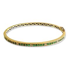 This emerald & diamond bangle is a stunner.  It adds flair, color, and an elegant bohemian vibe to any stack.  The bracelet measures 3.3mm wide and is available in 14k yellow, rose, or white gold.  It has a hidden closure complete with a safety lock.  Stack it alone or mix with other bracelets and dot bangles. Luxury Green Gemstone Bangle, Luxury Stackable May Birthstone Jewelry, Luxury Emerald Bangle Jewelry, Luxury Stackable Emerald Jewelry, Yellow Gold Emerald Bangle Bracelets, Yellow Gold Emerald Bangle Bracelet, Yellow Gold Emerald Bangle, Luxury Green Bangle Bracelets, Elegant Green Stackable Bracelets