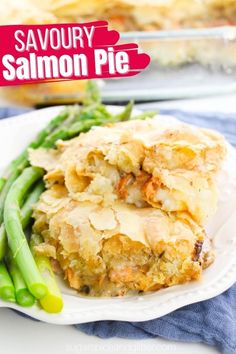 savory salmon pie on a plate with asparagus and green beans in the background