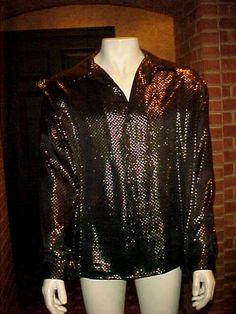 FOR SALE: VINTAGE MEN'S METALLIC SILK SHIRT BLACK WITH GOLD DOTS BEAUTIFUL. "GORGEOUS SHIRT". SIZE  X-LARGE SHOULDER TO SHOULDER        21        INCHES PIT TO PIT                                   24        INCHES SLEEVE                                       24        INCHES LENGTH TO HEM                        31        INCHES NO RETURNS PLEASE CHECK OUT ALL PHOTOS & MEASUREMENTS.       IF YOU HAVE ANY QUESTIONS PLEASE ASK. IF YOU HAVE TIME PLEASE CHECK OUT MY EBAY STORE & FEEDBACK YOU WILL NO Classic Gold Shirt For Party, Classic Gold Tops For Party, Gold Dots, Large Fashion, Silk Shirt, Accessories Men, Vintage Men, Black Shirt, Fashion Clothing