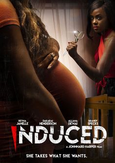 a pregnant woman holding a pair of scissors in front of a poster for an upcoming film