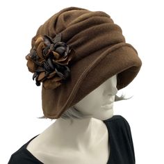 Alice wide from brim cloche hat for women handmade in brown fleece with satin hydrangea brooch in shades of brown Boston Millinery  modeled on a hat mannequin front side view Brimmed Brown Cloche Hat For Kentucky Derby, Brown Brimmed Cloche Hat For Kentucky Derby, Brown Cloche Hat With Short Brim, Brown Bucket Hat For Kentucky Derby, Elegant Brown Bucket Hat, Adjustable Brown Cloche Hat For Kentucky Derby, Fun Hats, Bespoke Hats, Social Media Buttons