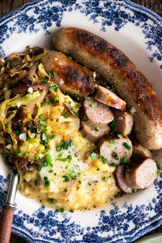 sausage and sauerkraut served on a blue and white plate