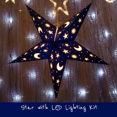 a star with led lighting kit hanging from the ceiling