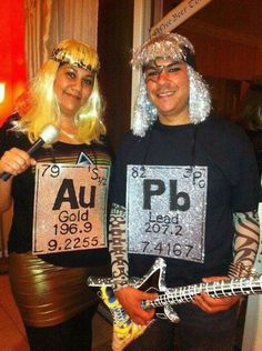 two people dressed up in costumes and holding guitars