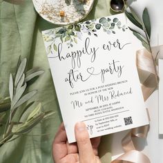 a person holding up a card with the words happily ever after party written on it