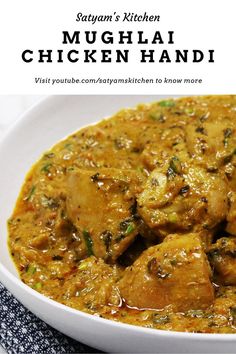 a close up of a bowl of food on a table with the words mughai chicken handi