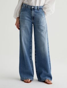 Our Stella palazzo pants are designed to be slung low on the waist and feature a super-wide cut through the legs. Crafted from 10 oz. Daytripper Stretch Denim, these wide-leg pants come in a light indigo wash with fading and whiskering. Slant pockets finish the look.Daytripper Stretch Denim, 10 Oz. 72% Cotton, 26% Lyocell, 2% Polyurethane Leather Outerwear, Jeans Outfits, Ag Jeans, Cardigan Sweater Dress, Dress The Population, Leather Blazer, Womens Loungewear, Palazzo Pants, Sweater And Shorts