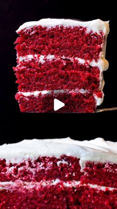 a slice of red velvet cake with white frosting on a black background and the rest of the cake in front