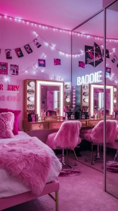 a bedroom with pink lights and pictures on the wall