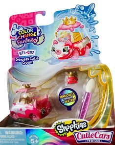 a pink toy car with a princess tiara on it's head in a box