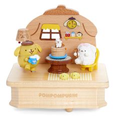 a wooden toy set with animals and a cake