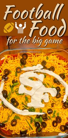 the football food for the big game is in a casserole dish with cheese and olives