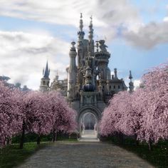 the castle is surrounded by trees with pink flowers on it's sides and its entrance