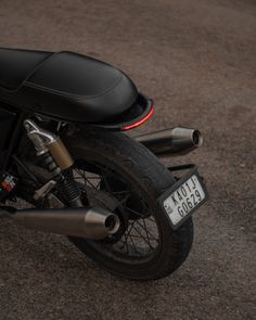 a black motorcycle parked on the street