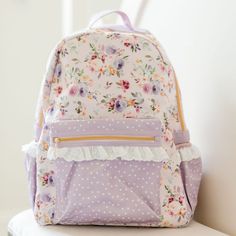 **PRE-ORDER ITEM SHIPS LATE JULY** Bree Backpack in Violet Breeze   16" Height x 12.5" Width x 6.5" Deep Easily holds folders or 3-ring binders for school Handle on top for easy carrying One zippered exterior front pocket Two exterior side pockets sized to fit water bottles Adjustable padded shoulder straps Binders For School, Cheeky Plum, Patriotic Accessories, Girls Halloween Outfits, Girls Holiday Dresses, Girls Easter Dresses, Girls Boutique Clothing, Girls Christmas Dresses, Girls Valentines