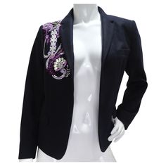 Introducing the exquisite Dries Van Noten Navy Crystal Embroidered Blazer, a timeless and luxurious piece that exudes sophistication and style. Crafted from classic navy fabric, this blazer features a whimsical paisley embroidery on the right shoulder, creating a bold and stunning detail that sets it apart from the rest. The paisley embroidery is adorned with metallic silver and purple beading, adding a touch of shimmer and elegance to the design. These beautiful colors complement the navy fabri Prada Loafers, Paisley Embroidery, Embroidered Blazer, Navy Fabric, Color Complement, Hermes Handbags, Dries Van Noten, Tailored Trousers, Polished Look