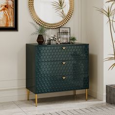 a green chest of drawers sitting next to a mirror and potted plant in a living room