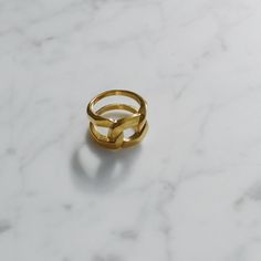 "A perfect statement ring, handcrafted with a chain styled band. This ring is well-made, eye-catching and pretty in gold color. Wear it to make your look fabulous. - Materials: 18K gold plated titanium - Measurements: approximately 0.6\" / 15mm in band width - Sizes: US6 - US9 - The product is tarnish-resistant and hypoallergenic Q&A 1. What is the material? - It is made from 18K real gold plated titanium. Titanium is nickel-free, zinc-free and hypoallergenic.. 2. Does the color tarnish? - T Trendy Yellow Gold Plated Midi Rings, Trendy Yellow Gold Metal Rings, Trendy Yellow Gold Rings, Adjustable Modern Ring, Modern Adjustable Yellow Gold Chain Ring, Modern Gold Metal Midi Rings, Minimalist Yellow Gold Rings, Adjustable Chain Gold Plated Open Ring, Adjustable Gold Plated Open Chain Ring