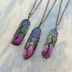 "These wire wrapped tree of life crystal pendant necklaces are handmade with rainbow ombre dyed aura quartz crystals and antique copper jewelry wire. ~Quartz Crystal Colors~ Each quartz crystal is unique and has varying saturation, shape, and size. *Note: The crystals used in this listing are imperfect and may have noticeable variations, blotchiness, and cloudiness in their coloring. Please refer to the photos to get a feel for the range in color, shape, and size that each of the pendants have.* Spiritual Wire Wrapped Multicolor Crystal Necklaces, Spiritual Multicolor Wire-wrapped Crystal Necklaces, Spiritual Multicolor Wire Wrapped Crystal Necklaces, Bohemian Iridescent Wire Wrapped Necklace, Antique Copper Jewelry, Witchy Grunge, Aqua Gemstone, Wire Wrapped Crystal Pendant, Crystal Colors