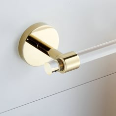 a close up of a door handle on a white door