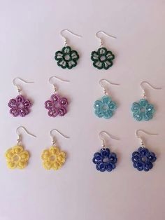 six pairs of earrings with flowers on them