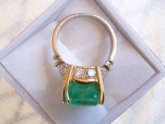 Simply sublime. This unique ring is the highlight of my Etsy collection. A rare stunner with an 8+ carat emerald and one carat total weight in white diamonds. This was a custom handmade ring I helped to design, and picked the stones myself, a rectangular shape natural emerald, gauging 13.00 x 10.40 x 9.00mm, exact weight 8.13 carats. 10 round brilliant cut diamonds accent the ring. One of the premier jewelers here in Wine Country made it; the top in pure 18K yellow gold and the shank in platinum Luxury Green Emerald Hallmarked Ring, Luxury Hallmarked Emerald Ring With Diamond, Luxury Emerald Rings Hallmarked, Luxury Green Diamond Ring Hallmarked, Luxury Hallmarked Green Diamond Ring, Luxury Green Hallmarked Diamond Ring, Luxury Hallmarked Emerald Wedding Ring, Luxury Green Diamond Ring For Formal Occasions, Formal Green Diamond Ring