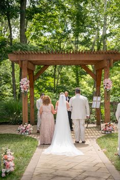 the bride and groom are walking down the aisle