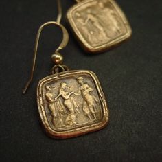 Handmade reproduction of intaglio cameo earrings representing this great odyssey scene of Odysseus returning to his queen Penelope.The cameo represents Queen of Ithaca, Penelope, being led in secret by her lady in waiting to her husband, Odysseus, who went missing during the Trojan War.The Odyssey is a Greek epic poem traditionally attributed to Homer, describing the travels of Odysseus during his ten years of wandering after the fall of Troy. He eventually returned home to Ithaca and killed the Odysseus And Penelope, Antique Cameo Jewelry, His Queen, Rome Antique, After The Fall, Tarpon Springs, Lady In Waiting, The Odyssey, Cameo Earrings