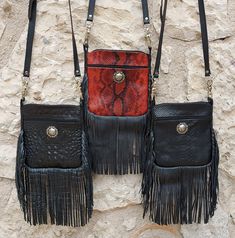 This handbag is made from authentic leather with an embossed finish of lizard, crocodile, or red snake. They are made by hand with an extraordinary craftsmanship to obtain an amazing finish, a durable product, and a lot of compliments! The measurements are: 8 inches depth 7 inches long 2 inches width Wholesale price by the dozen or more. Buy 3 dozen and you get free shipping! Send us a message for a quotation. We ship worldwide via FedEx. Leather Bags With Concho For Everyday Use, Handbag Ideas, Red Snake, Bridesmaid Gift Bags, Western Purses, Bridesmaid Bags, Fringe Bags, Print Finishes, Bags Purses