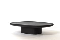 a black table sitting on top of a white floor