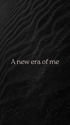 a black sand dune with the words'new era of me'written on it