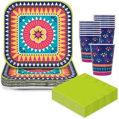 an assortment of party supplies including plates, napkins and cups with designs on them