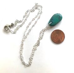 A rustic boho necklace that is perfect for wearing everyday. This can easily be layered with other pieces, but it looks great on its own. The pendant is real turquoise stone and measures approximately 15mm wide and 25mm high (although the sizes may vary slightly), and they are teardrop shaped. Please note that each of the stones has its own unique shape, size, and colorings, so yours may vary slightly from the photos. These are vibrant blue/green stones with earthy dark vein marks in some areas.