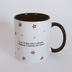 a black and white coffee mug with stars on it