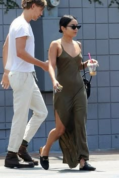 a man and woman walking down the street