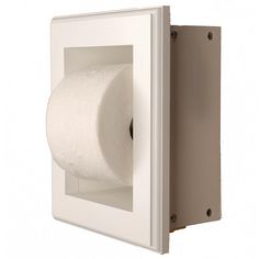 a toilet paper dispenser mounted on the wall with a roll of tissue in it