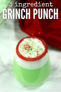 a green and white drink with red sprinkles on top