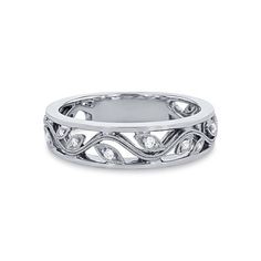 a white gold wedding band with diamonds on the sides and an intricate design in the middle