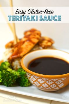 a white plate topped with meat and broccoli covered in sauce next to a bowl of dipping sauce