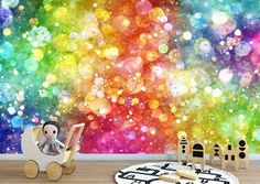 a colorful wall mural in a child's room with wooden toys on the floor