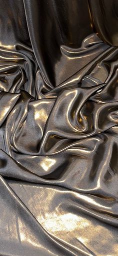 Our shimmer satin has a superior drape like no other. This luxurious fabric has a soft touch and glows beautifully creating a perfect blend between the shimmer and satin. Perfect for all types of dressmaking, crafting, decorating and various other projects.  *Colours may vary due to different screens.  *Width 58 inches *Synthetic *Machine Washable *If you order more than 1 meter, fabric will come as one continuous length. *Fast Delivery Before you go please check out our other items. We offer combined postage and special delivery. Lastly, we would appreciate if you can leave us feedback once items are received. Thank you. Luxurious Fabrics Textiles, Fabric Close Up, Metallic Fabric Texture, Elegant Fabrics, Aesthetic Fabric, Fabric Moodboard, Gold Abstract Wallpaper, Sheer Texture, Fabric Draping