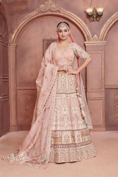 Item: Lehenga Set (Lehenga Skirt, Blouse, and 2 Dupattas) Embrace timeless elegance with our exquisite Pastel Magnolia Lehenga Set. Handcrafted by artisans who specialize in traditional embroidery methods, this ensemble exudes charm and sophistication. Every stitch tells a story, reflecting the rich heritage of Indian craftsmanship. This stunning lehenga in soft hues of pink, is an ode to 'simplicity is elegance'. The hand embroidery done by our artisans all over the lehenga along with the scall Lehenga With Double Dupatta, Embroidery Methods, Double Dupatta, Scalloped Blouse, Special Occasion Gowns, Traditional Embroidery, Skirt Blouse, Lehenga Skirt, Red Lehenga