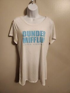 a white tee shirt with the words dunder mifflin in blue on it