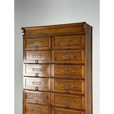 a large wooden dresser with many drawers on it's sides and one drawer open