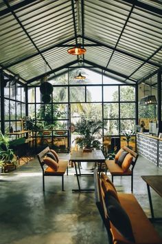 the inside of a restaurant with tables and chairs