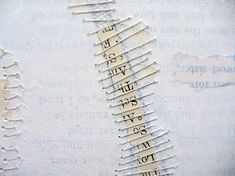 a close up of a ruler on a piece of paper with numbers and letters in it