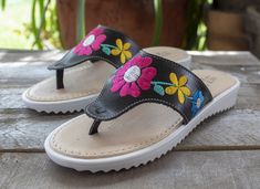 New womens flower embroidered leather slip on authentic mexican huarache sandals Comfortable Sandals With Rubber Sole For Spring, Comfortable Casual Flip Flops For Spring, Comfortable Toe Post Sandals For Spring, Spring Slip-on Sandals With Stitched Sole, Spring Sandals With Rubber Sole And Round Toe, Leather Slip-on Sandals For Spring, Spring Round Toe Rubber Sole Flip Flops, Spring Rubber Sole Round Toe Flip Flops, Comfortable Slip-on Spring Flip Flops