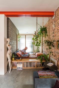 a man sitting on a couch in a living room