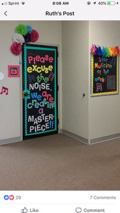 an office decorated with bulletin boards and pom poms on the door to each room