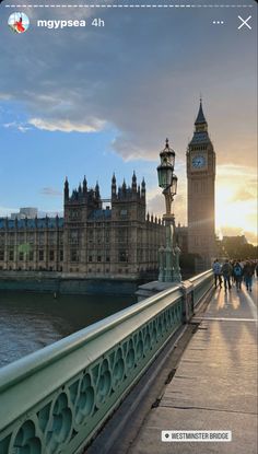 the big ben clock tower towering over the city of london, england at sunset or dawn